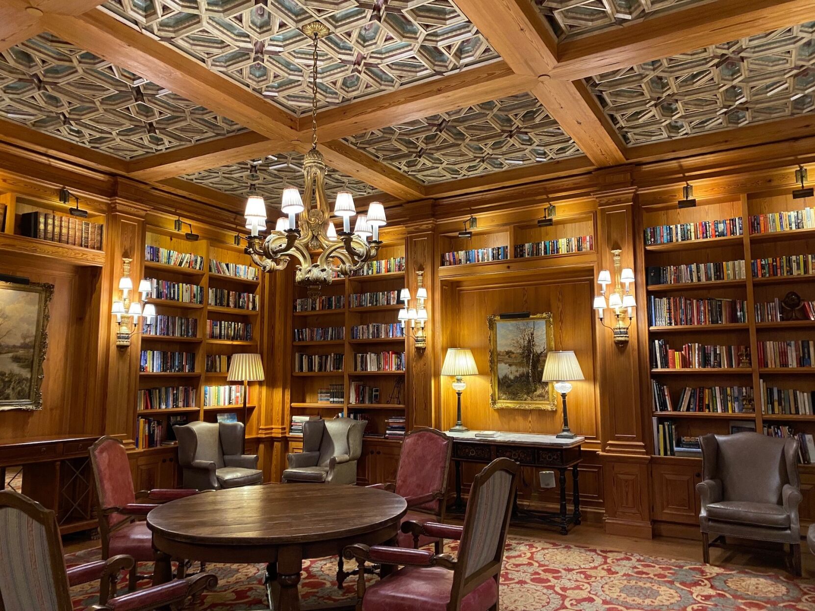 The library features heart pine walls and custom chandeliers.